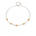 Collar cadena plateado con esferas dorado
