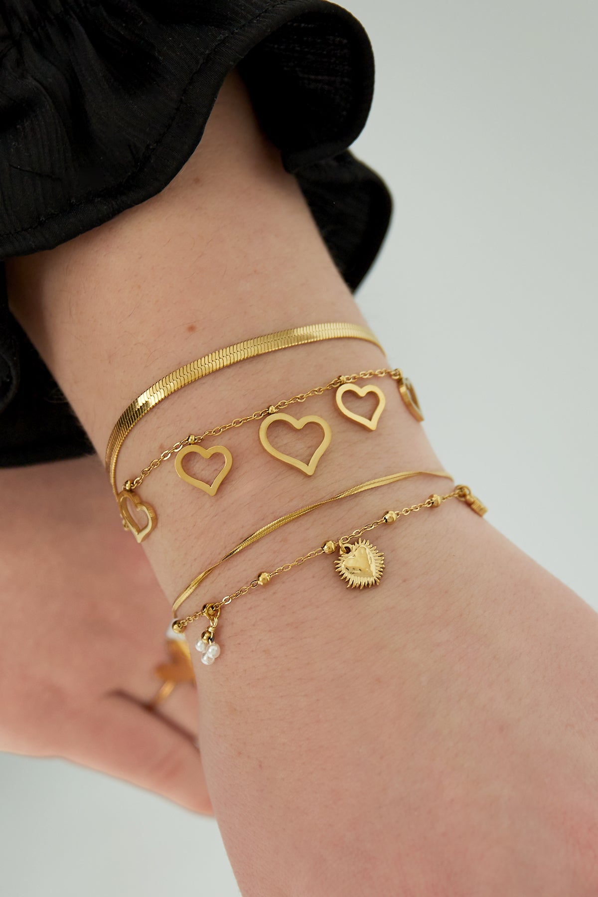 Pulsera doble con charms de corazón