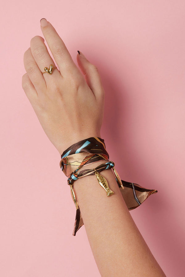 Pulseras  con dijes de pez